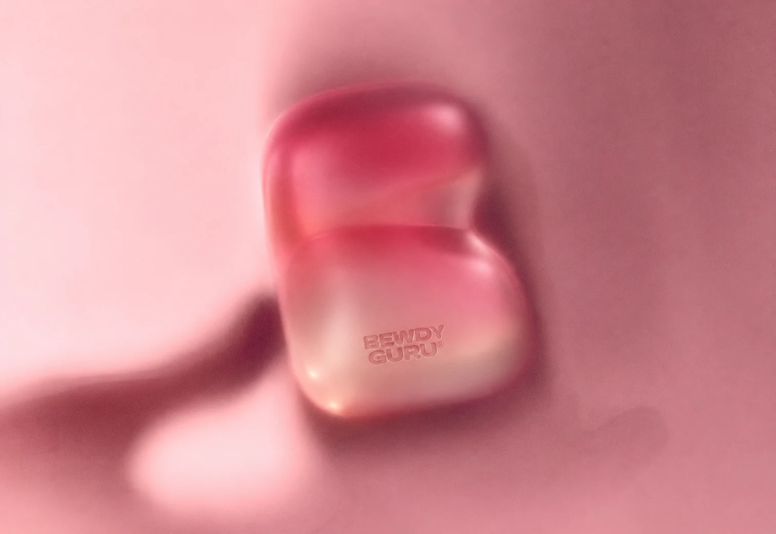 Dreamy pink close-up of the Bewdy Guru device